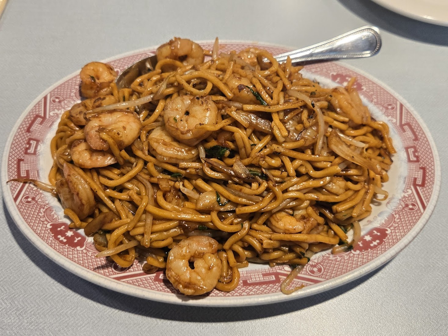 Shrimp lo mein on the classic red plate